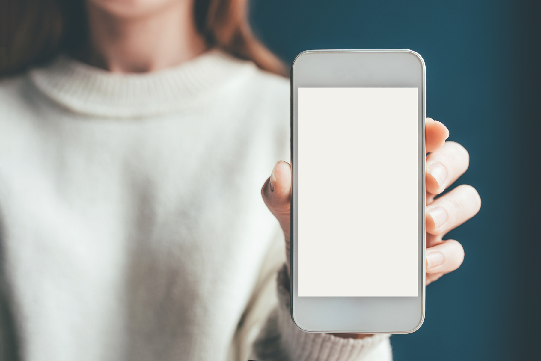 Woman Hand Holding Phone with White Screen