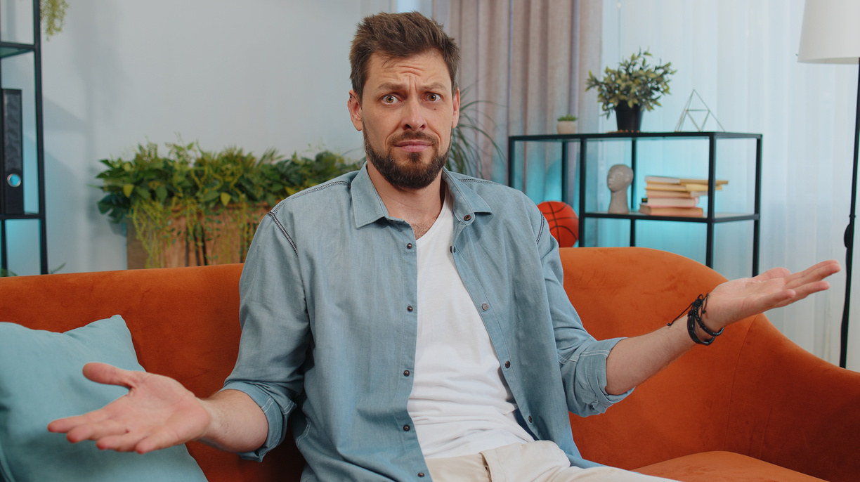 Young man guy asking why, what reason of failure, demonstrating disbelief irritation by troubles